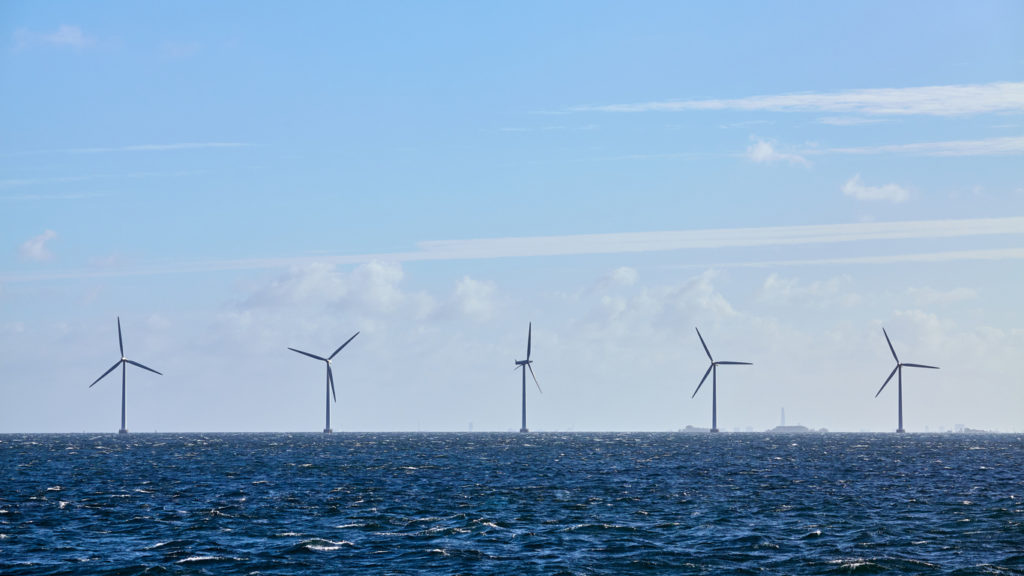 Row of offshore wind turbines.